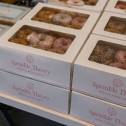 Custom donut boxes on a display table